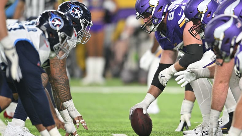 Vikings and Titans lined up at the line of scrimmage during a preseason game at U.S. Bank Stadium