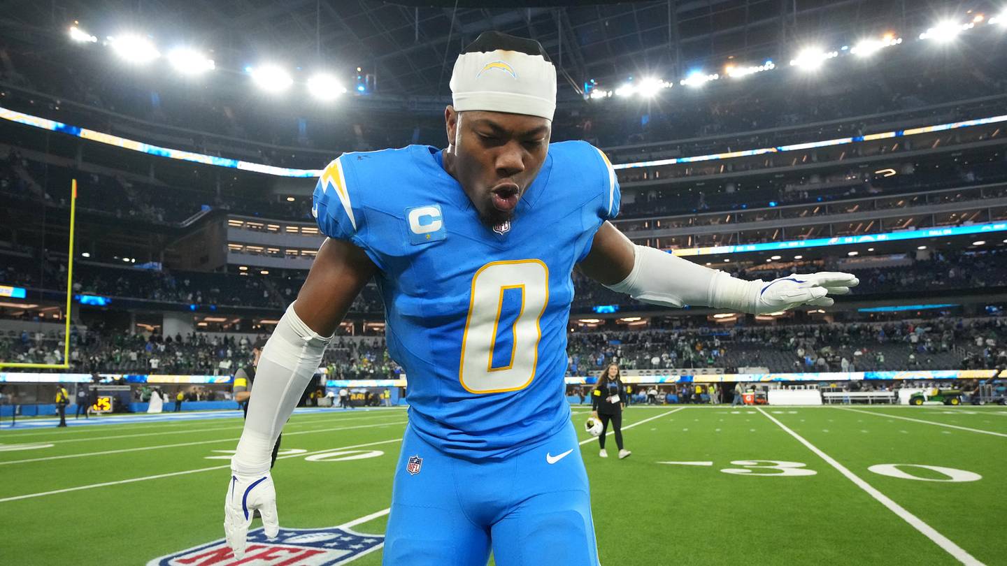 Dec 8, 2025; Inglewood, California, USA; Los Angeles Chargers linebacker Daiyan Henley (0) celebrates after defeating the Philadelphia Eagles in overtime at SoFi Stadium. Mandatory Credit: Kirby Lee-Imagn Images