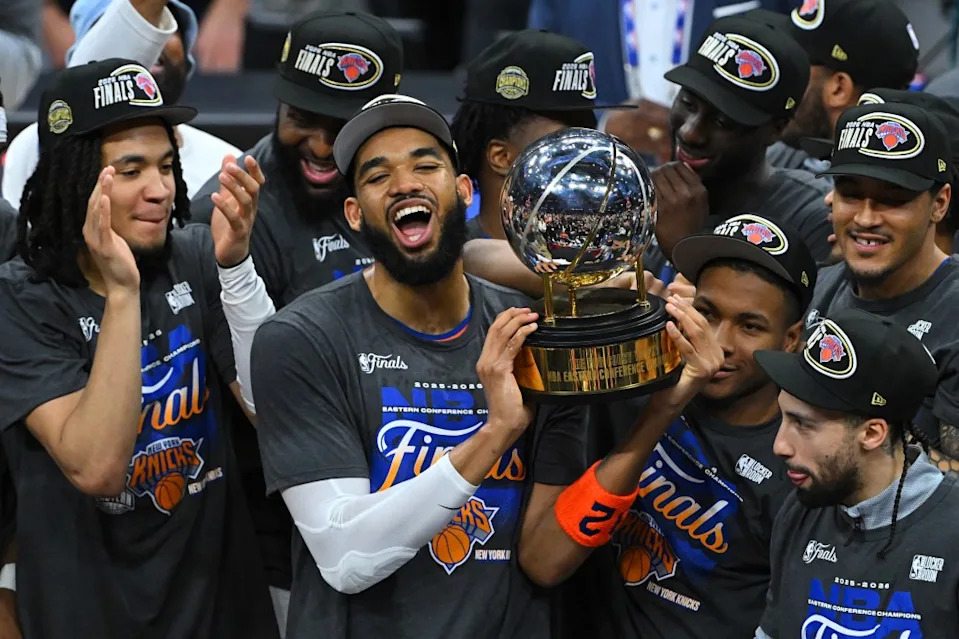 The New York Knicks celebrate with the Bob Cousy Trophy after defeating the <a class="link " href="https://sports.yahoo.com/nba/teams/cleveland/" data-i13n="sec:content-canvas;subsec:anchor_text;elm:context_link" data-ylk="slk:Cleveland Cavaliers;sec:content-canvas;subsec:anchor_text;elm:context_link;itc:0" data-yga="{"yLinkElement":"context_link","yModuleName":"content-canvas","yLinkText":"Cleveland Cavaliers","ySubModuleName":"anchor_text","yHasCommerce":false}">Cleveland Cavaliers</a> 130-93 in Game Four of the NBA Eastern Conference Finals at Rocket Arena on May 25, 2026 in <a class="link " href="https://sports.yahoo.com/nba/teams/cleveland/" data-i13n="sec:content-canvas;subsec:anchor_text;elm:context_link" data-ylk="slk:Cleveland;sec:content-canvas;subsec:anchor_text;elm:context_link;itc:0" data-yga="{"yLinkElement":"context_link","yModuleName":"content-canvas","yLinkText":"Cleveland","ySubModuleName":"anchor_text","yHasCommerce":false}">Cleveland</a>, Ohio. (Photo by Jason Miller/Getty Images)