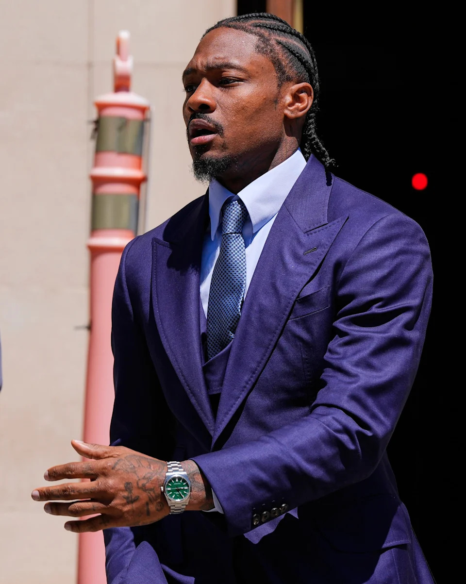 Former New England Patriots wide receiver Stefon Diggs leaves Norfolk County District Court, Monday, May 4, 2026, in Dedham, Mass. (AP Photo/Charles Krupa)