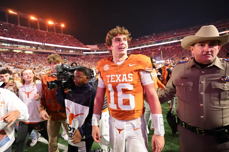 Arch Manning of the Texas Longhorns walks off the field after beating the Texas A&M Aggies 27-17