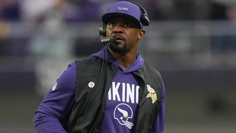 Brian Flores watches the field during a Vikings game against the Green Bay Packers at U.S. Bank Stadium. Vikings 2026 prediction
