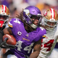 Sep 15, 2024; Minneapolis, Minnesota, USA; Minnesota Vikings safety Josh Metellus (44) intercepts the ball against the San Francisco 49ers in the third quarter at U.S. Bank Stadium.