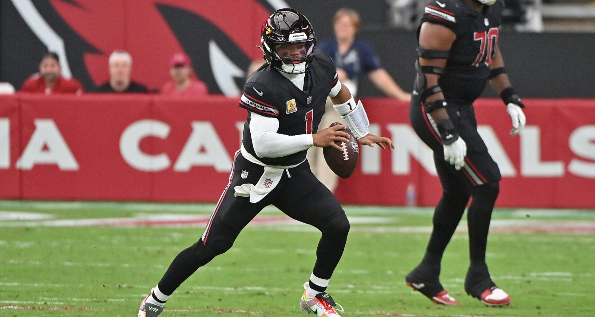 Oct 5, 2025; Glendale, Arizona, USA; Arizona Cardinals quarterback Kyler Murray (1) looks to throw against the Tennessee Titans during the second quarter at State Farm Stadium.