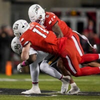 Oct 25, 2025; Cincinnati, Ohio, USA; Baylor Bears tight end Michael Trigg (1) is unable to hold on to a catch as he is tackled by Cincinnati Bearcats linebacker Jake Golday (11) and defensive back Tre Gola-Callard (6) in the second half at Nippert Stadium.