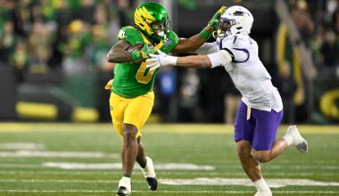 Dec 20, 2025; Eugene, OR, USA; Oregon Ducks running back Jordon Davison (0) rushes and stiff arms James Madison Dukes safety Jacob Thomas (7) during the second quarter at Autzen Stadium.