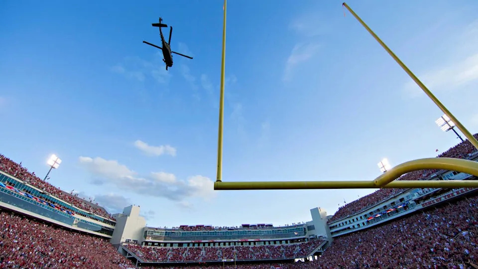 FAYETTEVILLE, AR - SEPTEMBER 17: UH-60 Black Hawk helicopters do a flyover before a game between the Arkansas Razorbacks and the Texas State Bobcats at Razorback Stadium on September 17, 2016 in Fayetteville, Arkansas. The Razorbacks defeated the Bobcats 42-3. (Photo by Wesley Hitt/Getty Images)