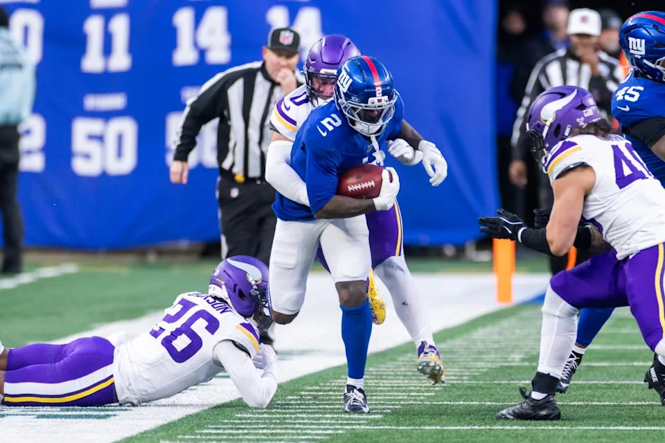 Cornerback Deonte Banks #2 of the New York Giants runs the ball as linebacker Ivan Pace Jr. #0 of the Minnesota Vikings tackles. Corey Sipkin for the NY POST