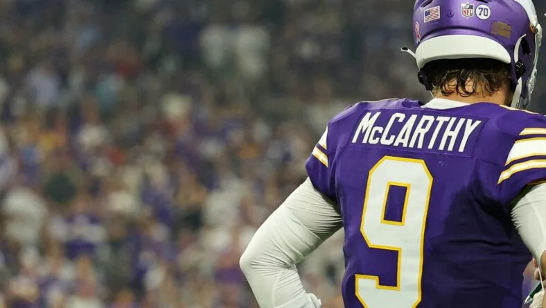 Vikings quarterback J.J. McCarthy speaks with head coach Kevin O’Connell during a game against the Falcons. Vikings quarterback battle