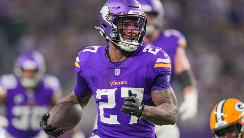 Cam Akers runs with the football during a Vikings game against the Green Bay Packers at U.S. Bank Stadium. Vikings reunions