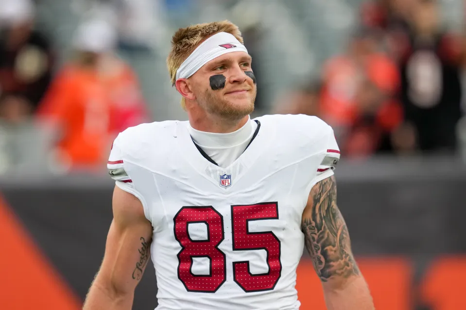 Trey McBride #85 of the Arizona Cardinals walks across the field before the game against the Cincinnati Bengals at Paycor Stadium 