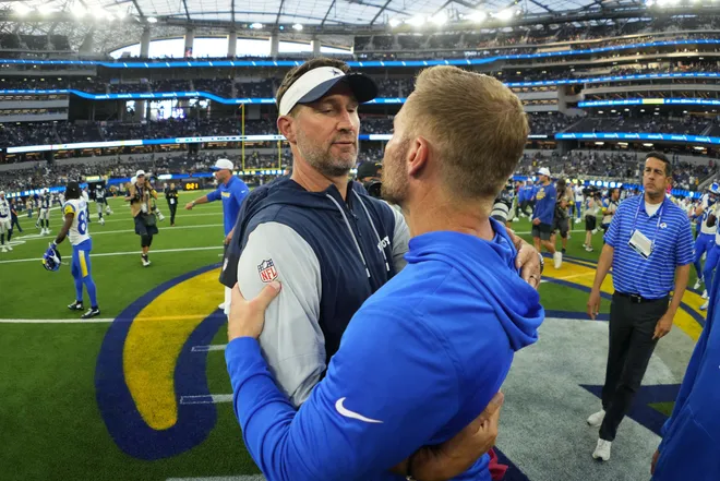 Aug 9, 2025; Inglewood, California, USA; Dallas Cowboys coach Brian Schottenheimer (left) embraces Los Angeles Rams coach Sean McVay after the game at SoFi Stadium. Mandatory Credit: Kirby Lee-Imagn Images