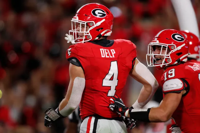 Georgia tight end Oscar Delp (4) celebrates after scoring touchdown during the first half of a NCAA college football game against Kentucky in Athens, Ga., on Saturday, Oct. 7, 2023.