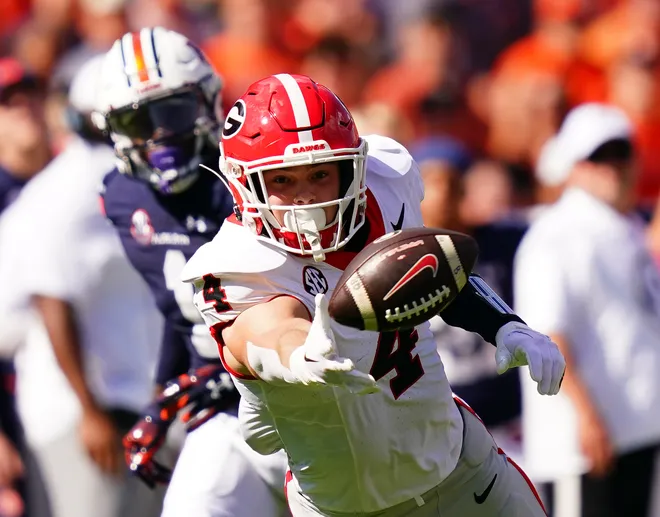 Sep 30, 2023; Auburn, Alabama, USA; Georgia Bulldogs tight end Oscar Delp (4) dives on a pass attempt against the Auburn Tigers during the first quarter at Jordan-Hare Stadium. Mandatory Credit: John David Mercer-USA TODAY Sports