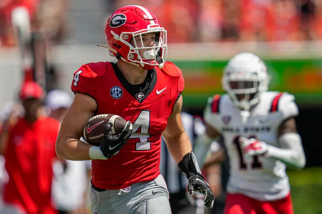 Sep 9, 2023; Athens, Georgia, USA; Georgia Bulldogs tight end Oscar Delp (4) runs after a catch against the Ball State Cardinals during the second half at Sanford Stadium. Mandatory Credit: Dale Zanine-USA TODAY Sports