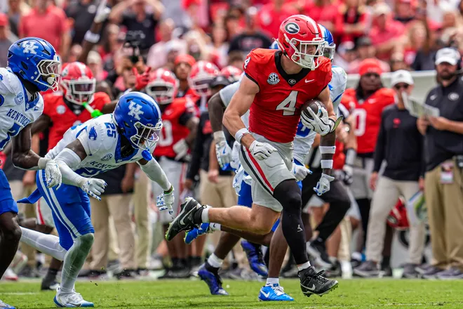 Oct 4, 2025; Athens, Georgia, USA; Georgia Bulldogs tight end Oscar Delp (4) runs against the Kentucky Wildcats after a catch at Sanford Stadium. Mandatory Credit: Dale Zanine-Imagn Images