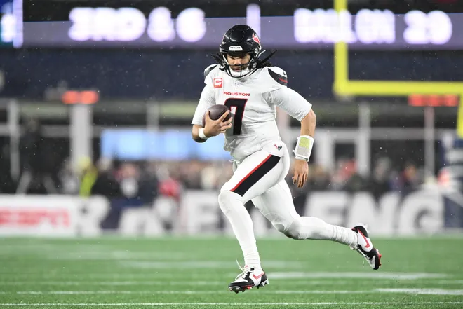 Jan 18, 2026; Foxborough, MA, USA; Houston Texans quarterback C.J. Stroud (7) runs with the ball in the third quarter against the New England Patriots in an AFC Divisional Round game at Gillette Stadium. Mandatory Credit: Brian Fluharty-Imagn Images