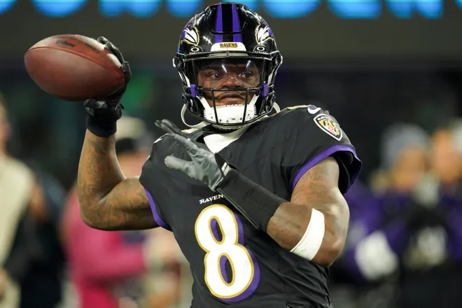 Dec 21, 2025; Baltimore, Maryland, USA; Baltimore Ravens quarterback Lamar Jackson (8) warms up prior to the game against the New England Patriots at M&T Bank Stadium. Mandatory Credit: Mitch Stringer-Imagn Images