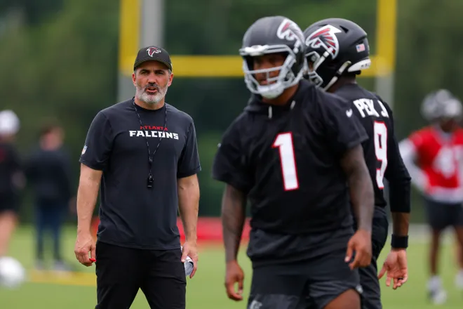 FLOWERY BRANCH, GEORGIA - MAY 27: Head coach Kevin Stefanski looks on as quarterback Tua Tagovailoa #1 of the Atlanta Falcons runs through drills during OTA's at IBM Performance Field on May 27, 2026 in Flowery Branch, Georgia. (Photo by Todd Kirkland/Getty Images)