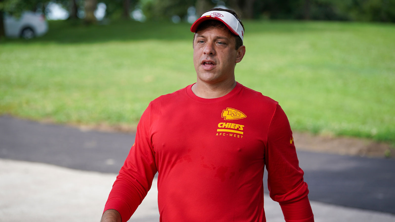 Kansas City Chiefs general manager Brett Veach walks down the hill to the fields during training camp at Missouri Western State University.