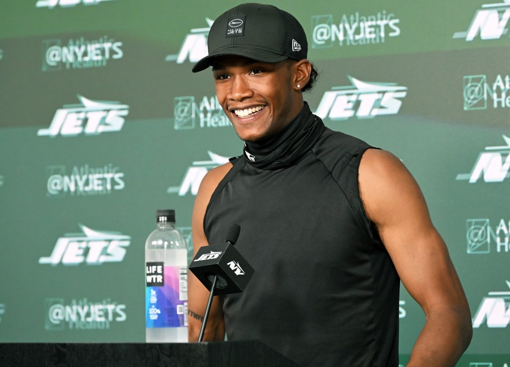 Garrett Wilson is all smiles while he talks with reporters during Jets OTA's on May 28, 2026 in Florham Park, N.J.