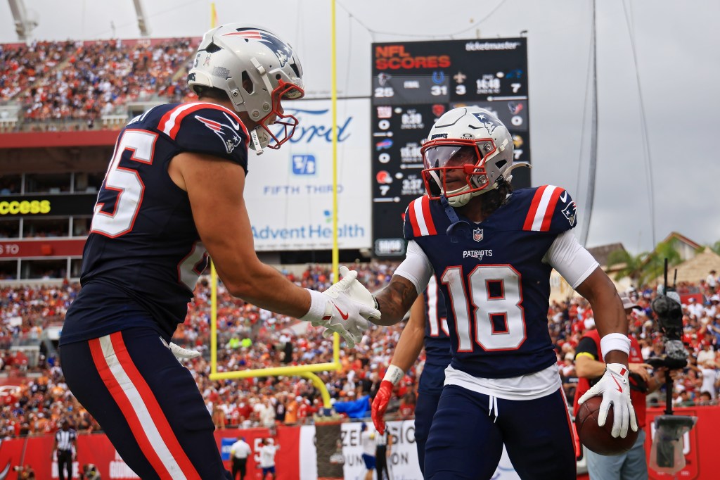 Kyle Williams celebrating with a teammate during a Patriots game against the Buccaneers.