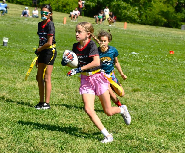 Falcons Willa Martin turns upfield with a full head of steam. (Photo by Rick Cawley)