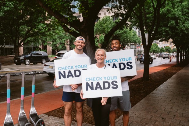 Broncos linebacker Alex Singleton (left), Testicular Cancer Awareness Foundation founder Kim Jones (center) and Broncos cornerback Jahdae Barron at April 12's "Ball March" hosted by underwear company Nads. (Photo courtesy of Lauren Grover/Dumpster Dive Photography) 