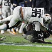 Dec 14, 2024; Landover, Maryland, USA; Navy Midshipmen defensive tackle Landon Robinson (96) fumbles after colliding with Army Black Knights linebacker Baylor Newsom (21) on a punt return at Commanders Field.