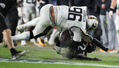 Dec 14, 2024; Landover, Maryland, USA; Navy Midshipmen defensive tackle Landon Robinson (96) fumbles after colliding with Army Black Knights linebacker Baylor Newsom (21) on a punt return at Commanders Field.