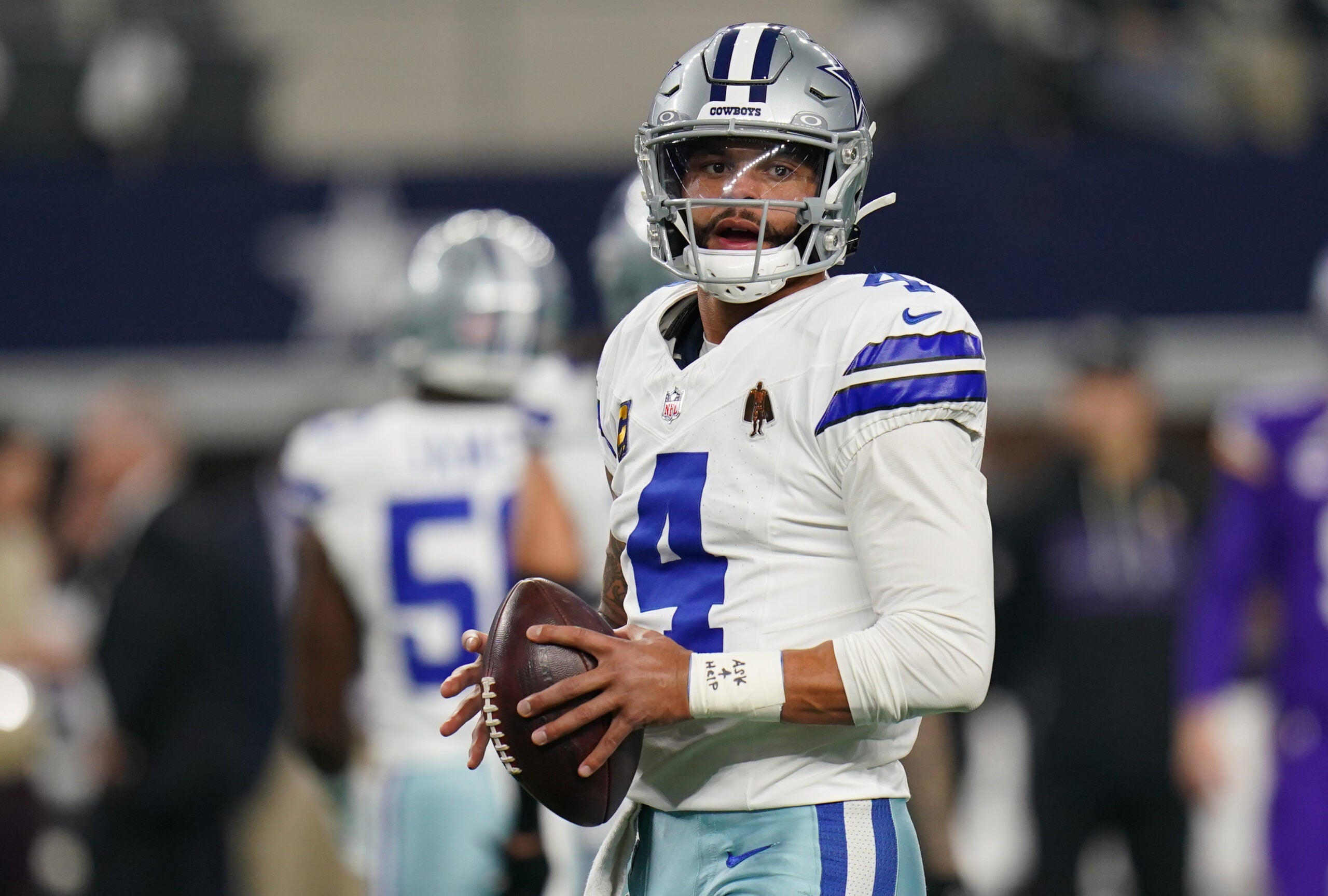 Dec 14, 2025; Arlington, Texas, USA; Dallas Cowboys quarterback Dak Prescott (4) warms up before a game against the Minnesota Vikings at AT&T Stadium.