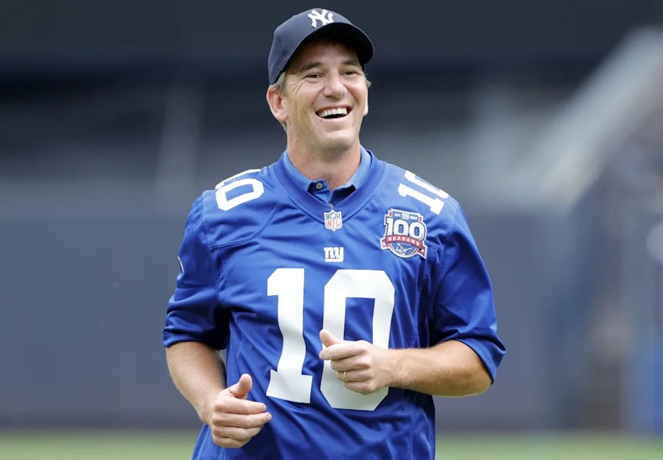 Eli Manning is all smiles after throwing out a ceremonial first pitch during a Yankees game in 2024. Jason Szenes for New York Post