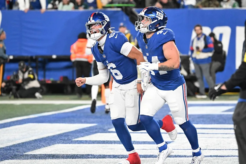 Cam Skattebo (44) and Giants quarterback Jaxson Dart (6) celebrate after Skattebo scores a touchdown during the second quarter of the Giants and <a class="link " href="https://sports.yahoo.com/nfl/teams/philadelphia/" data-i13n="sec:content-canvas;subsec:anchor_text;elm:context_link" data-ylk="slk:Philadelphia Eagles;sec:content-canvas;subsec:anchor_text;elm:context_link;itc:0" data-yga="{"yLinkElement":"context_link","yModuleName":"content-canvas","yLinkText":"Philadelphia Eagles","ySubModuleName":"anchor_text","yHasCommerce":false}">Philadelphia Eagles</a> game in East Rutherford. Bill Kostroun/New York Post