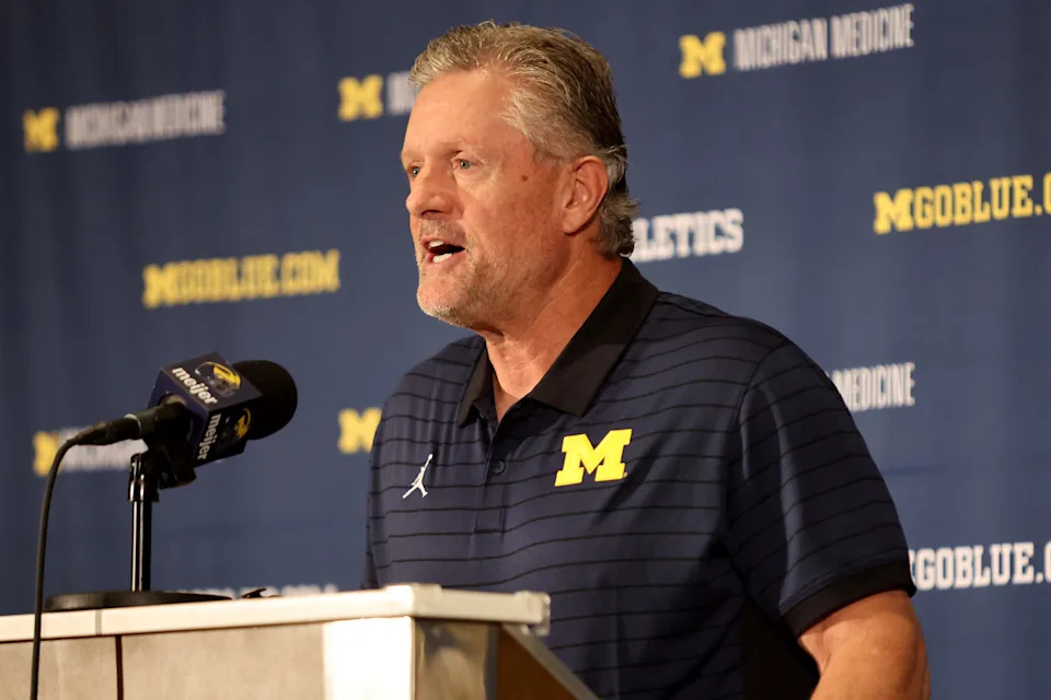 ORLANDO, FLORIDA - DECEMBER 28: Kyle Whittingham speaks at a news conference introducing him as the new Michigan Wolverines head football coach at the Hyatt Regency Orlando on December 28, 2025 in Orlando, Florida. (Photo by Dustin Markland/Getty Images)