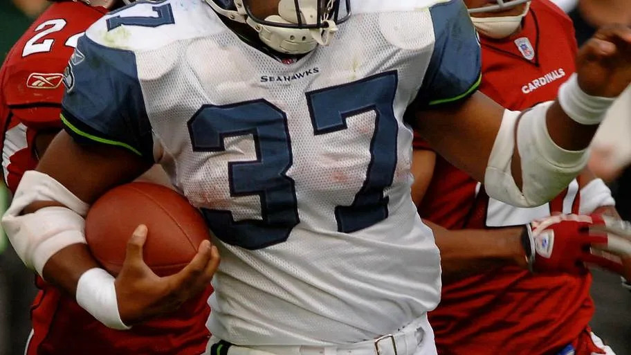 Seattle Seahawks running back Shaun Alexander rushes the ball for an 88 yard touchdown run against the Arizona Cardinals.