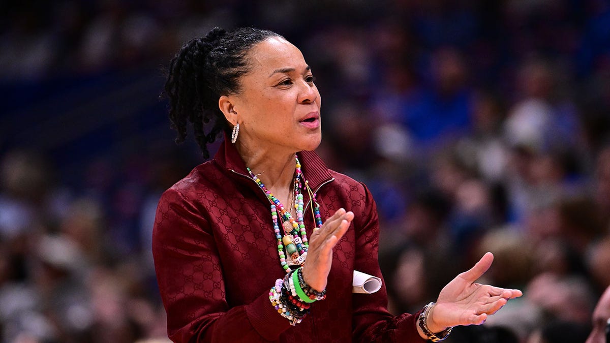 Head coach Dawn Staley reacting on the sidelines during NCAA Women's Basketball Tournament Final Four game