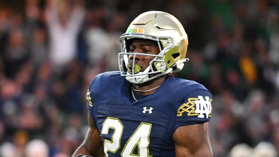 Notre Dame Fighting Irish RB Jadarian Price carries for a touchdown in the first quarter against the Navy Midshipmen.