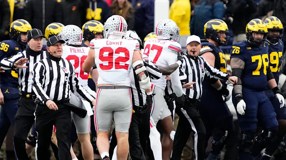 Officials separate <a class="link " href="https://sports.yahoo.com/ncaaf/teams/michigan/" data-i13n="sec:content-canvas;subsec:anchor_text;elm:context_link" data-ylk="slk:Michigan Wolverines;sec:content-canvas;subsec:anchor_text;elm:context_link;itc:0" data-yga="{"yLinkElement":"context_link","yModuleName":"content-canvas","yLinkText":"Michigan Wolverines","ySubModuleName":"anchor_text","yHasCommerce":false}">Michigan Wolverines</a> and Ohio State Buckeyes players during the NCAA football game at Michigan Stadium in Ann Arbor, Mich. on Nov. 29, 2025.© Adam Cairns&sol;Columbus Dispatch &sol; USA TODAY NETWORK via Imagn Images