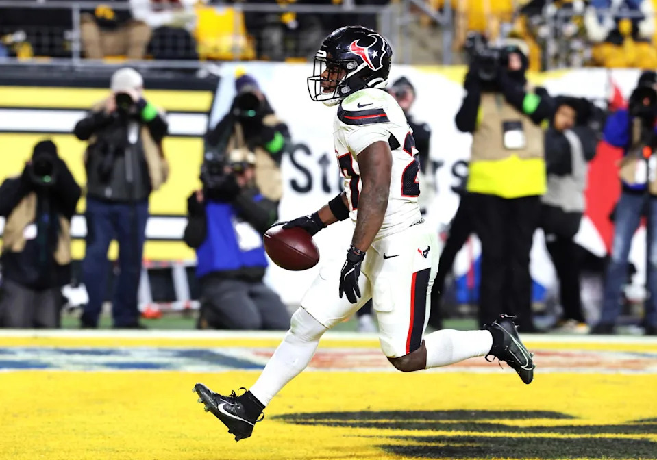 Houston Texans running back Woody Marks (27) scores a touchdown during the second half of an AFC Wild Card Round game against the Pittsburgh Steelers at Acrisure Stadium. Charles LeClaire-Imagn Images