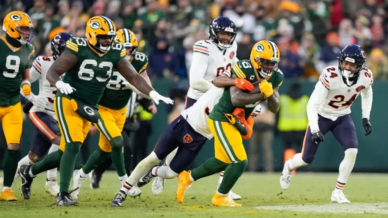 Josh Jacobs is tackled by Kevin Byard III during a Packers-Bears game at Lambeau Field. Vikings schedule