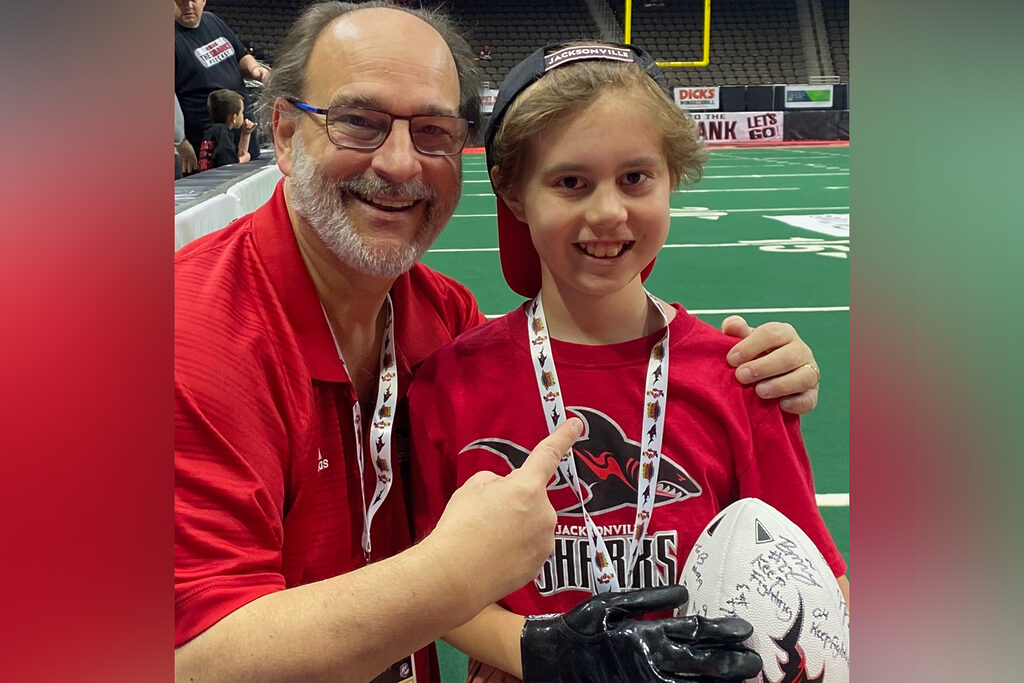 Man and boy at football game