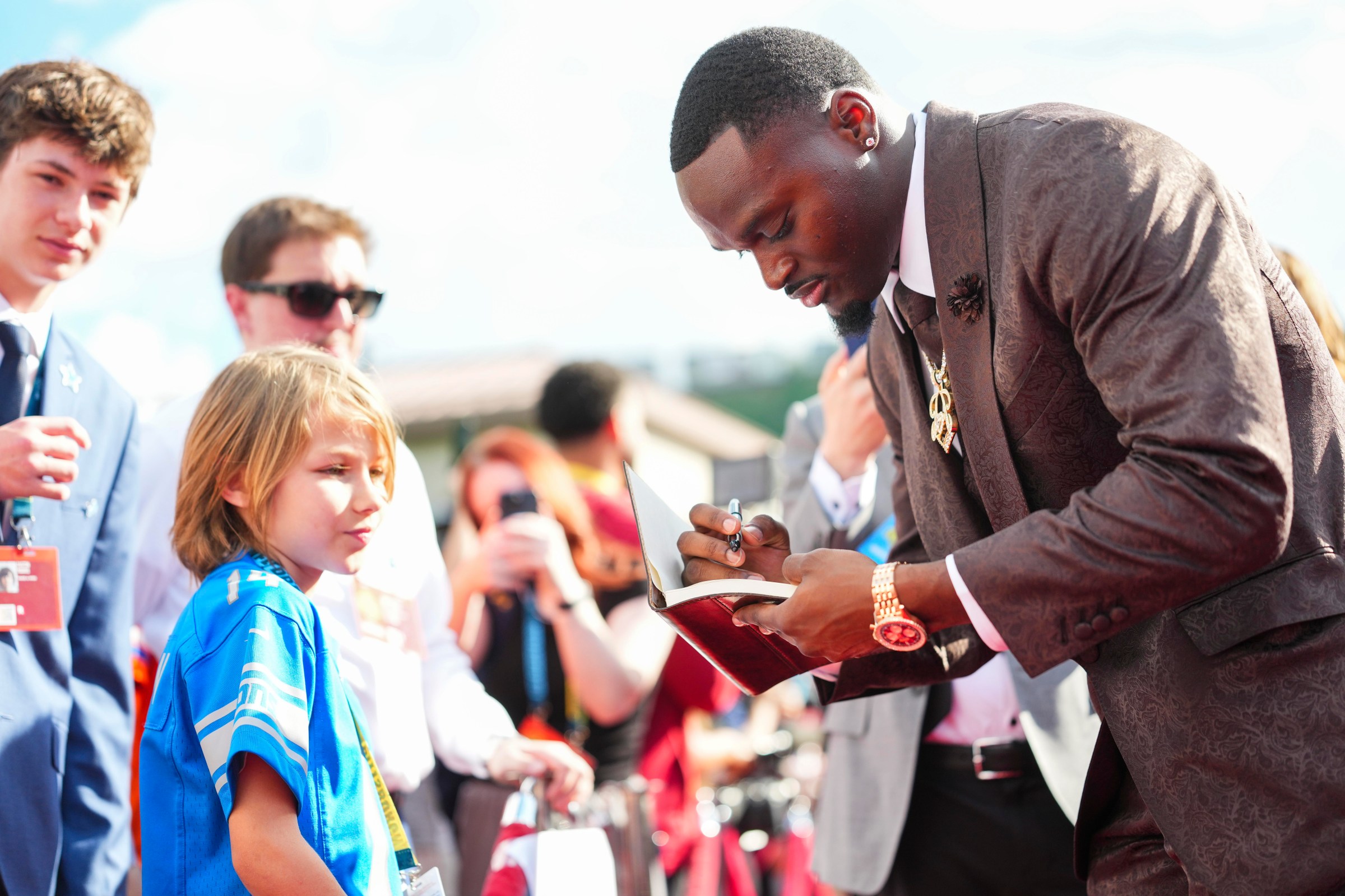 Notre Dame running back Jeremiyah Love interacts with a Make-A-Wish kid on the red carpet for the 2026 NFL Draft