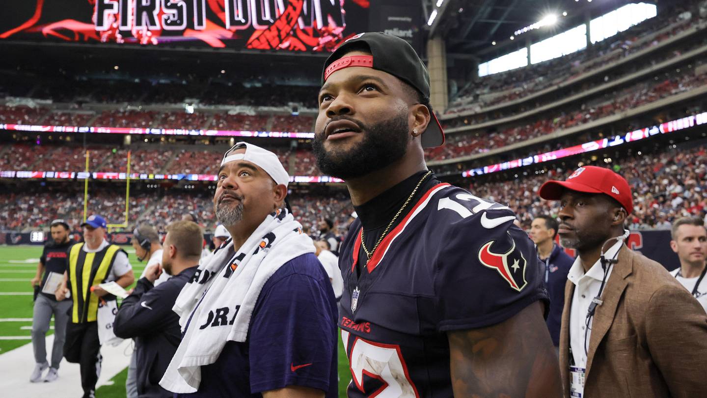 Aug 16, 2025; Houston, Texas, USA; Houston Texans wide receiver Nico Collins (12) watches the Houston Texans rush for a first down against the Carolina Panthers in the second half at NRG Stadium. Mandatory Credit: Thomas Shea-Imagn Images