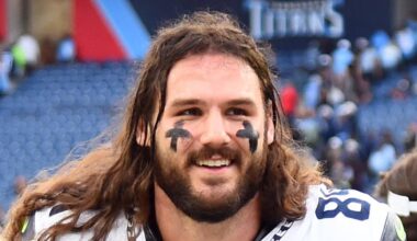 Former Seattle Seahawks tight end Colby Parkinson celebrates as he leaves the field