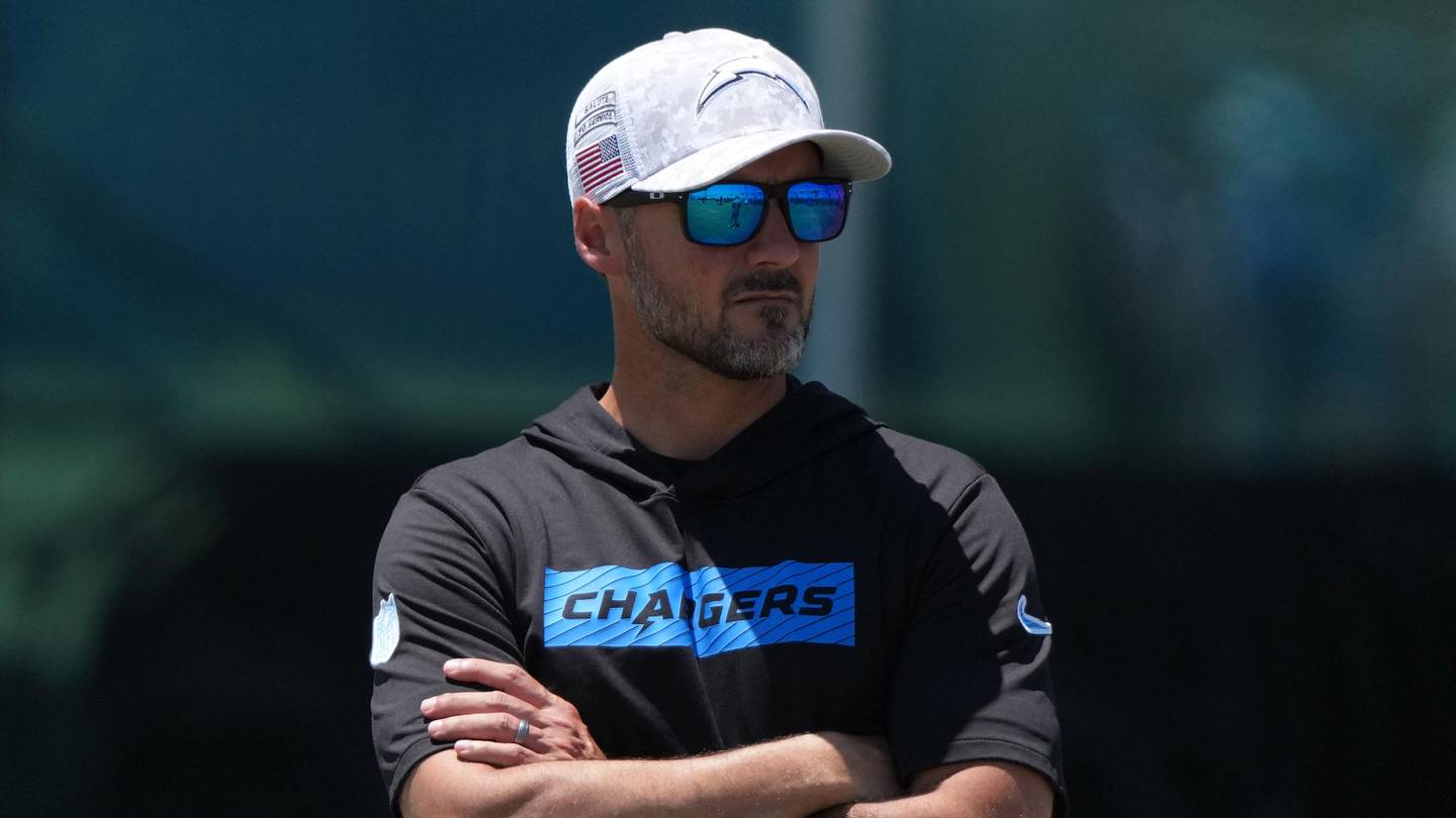 Jun 16, 2025; El Segundo, CA, USA; Los Angeles Chargers defensive coordinator Jesse Minter watches during organized team activities at The Bolt. Mandatory Credit: Kirby Lee-Imagn Images