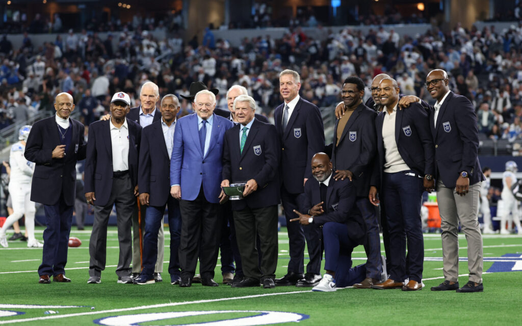 Dec 30, 2023; Arlington, Texas, USA; Dallas Cowboys former head coach Jimmy Johnson poses for a photo with former players and owner Jerry Jones after being inducted into the ring of honor at halftime of the game against the Detroit Lions at AT&T Stadium. Mandatory Credit: Kevin Jairaj-USA TODAY Sports
