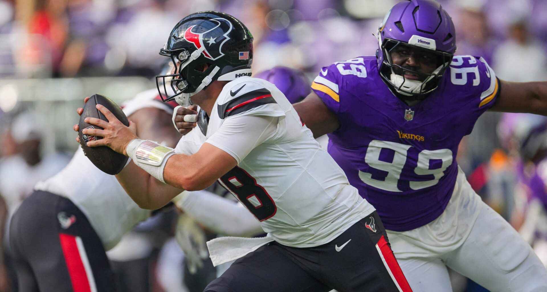 Aug 9, 2025; Minneapolis, Minnesota, USA; Houston Texans wide receiver John Metchie III (8) evades Minnesota Vikings defensive end Elijah Williams (99) in the fourth quarter at U.S. Bank Stadium.
