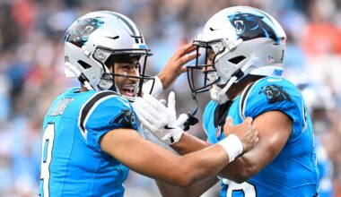 Aug 8, 2025; Charlotte, North Carolina, USA; Carolina Panthers wide receiver Jalen Coker (18) celebrates with quarterback Bryce Young (9) after a touchdown catch in the first quarter at Bank of America Stadium.