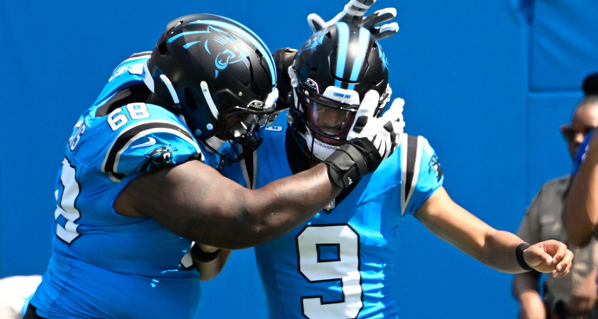 Sep 21, 2025; Charlotte, North Carolina, USA; Carolina Panthers quarterback Bryce Young (9) celebrates with guard Damien Lewis (68) after scoring a touchdown in the first quarter at Bank of America Stadium.