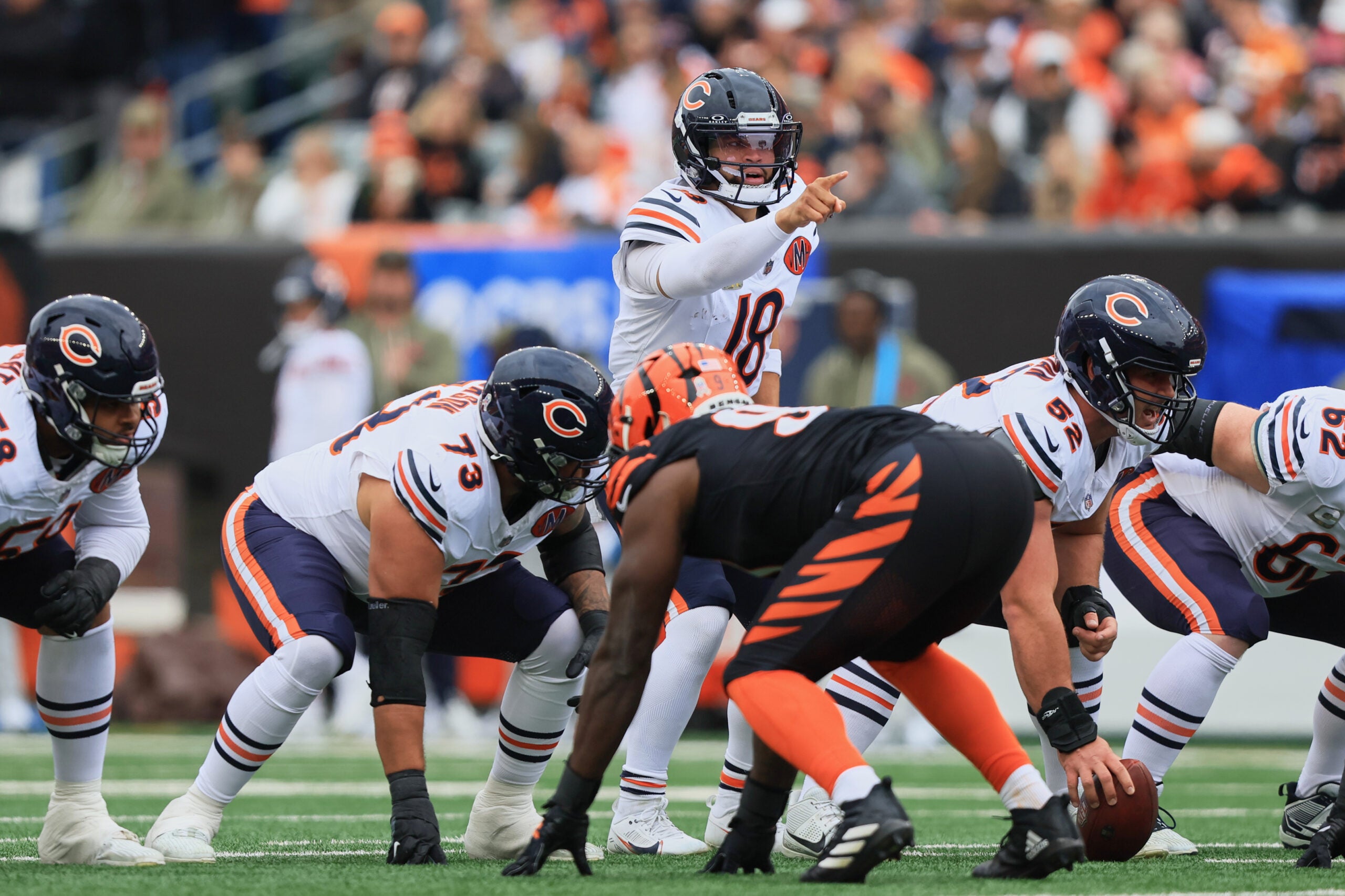 Nov 2, 2025; Cincinnati, Ohio, USA; Chicago Bears quarterback Caleb Williams (18) gestures toward the Cincinnati Bengals defense at the line of scrimmage during the first quarter at Paycor Stadium.